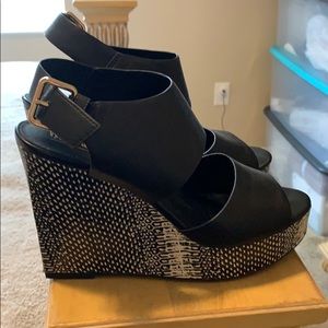 Black and snake skin wedges